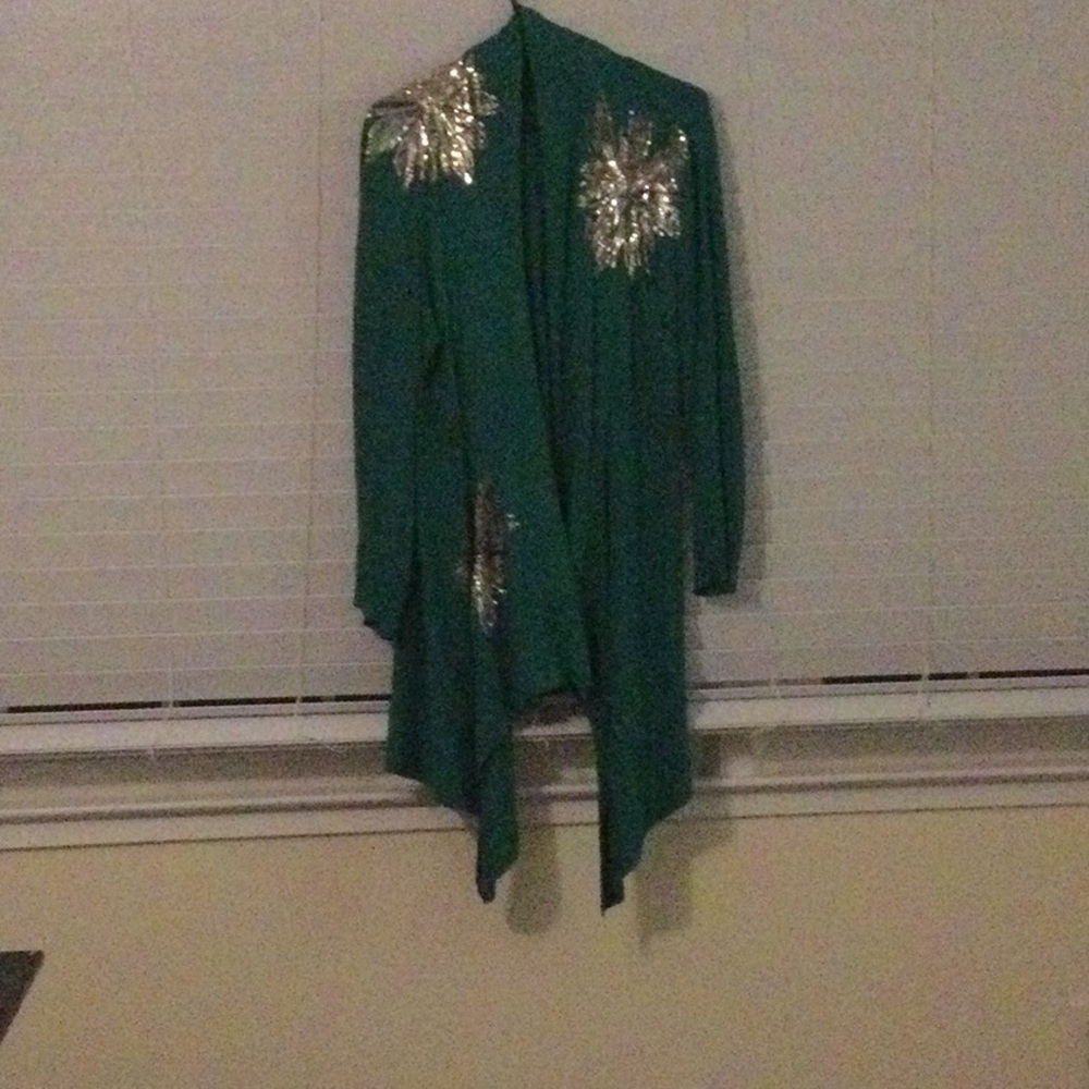 Long green cardigan with sequined snowflakes.